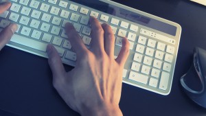 man with hand on keyboard
